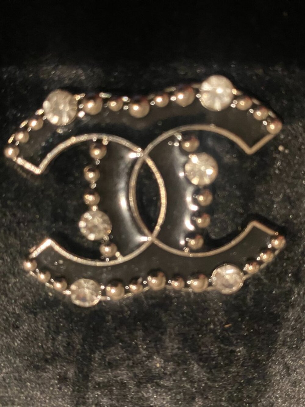 CC Silver tone emblem black with rhinestones